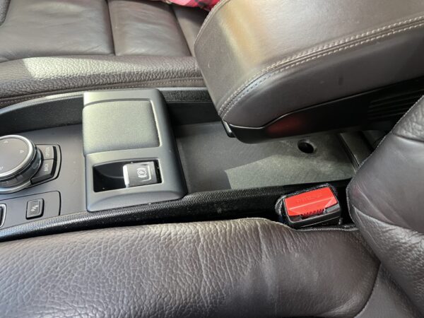 BMW i3 accessory that creates a hidden compartment and shelf under the armrest - Image 7
